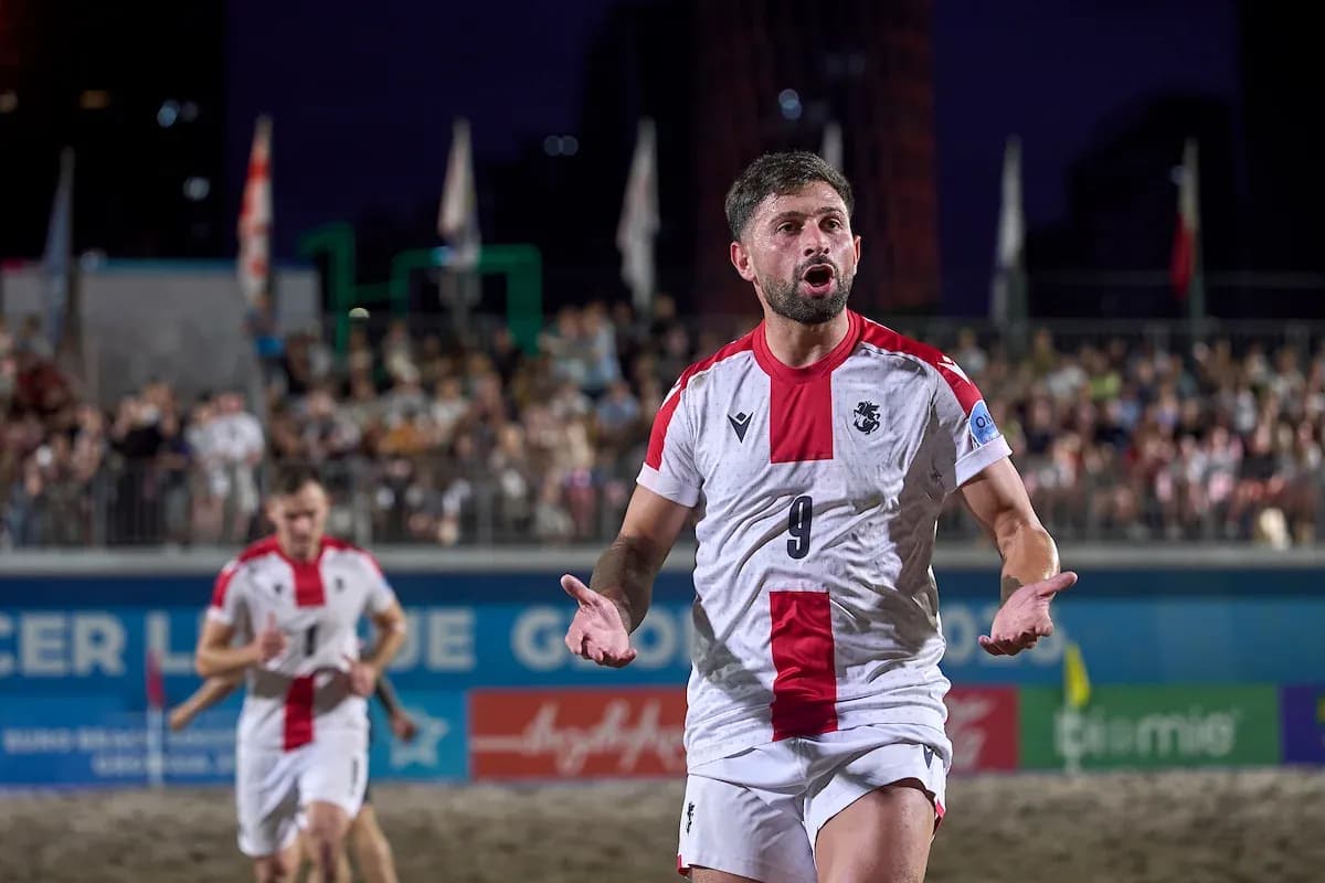 Player gesturing during beach soccer match