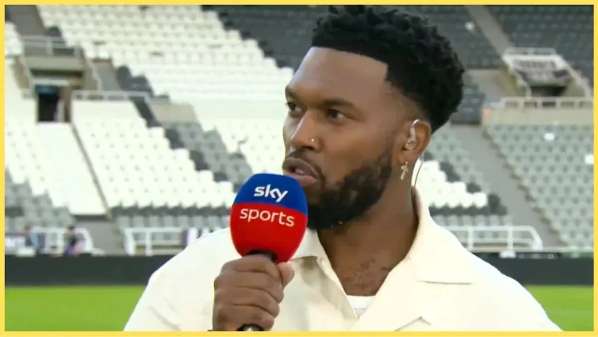 Analyst speaking during post-match interview on pitch