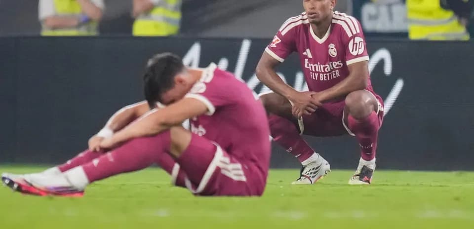 Real Madrid players reacting after match defeat