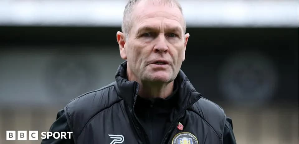 Men's football manager speaking during a training session
