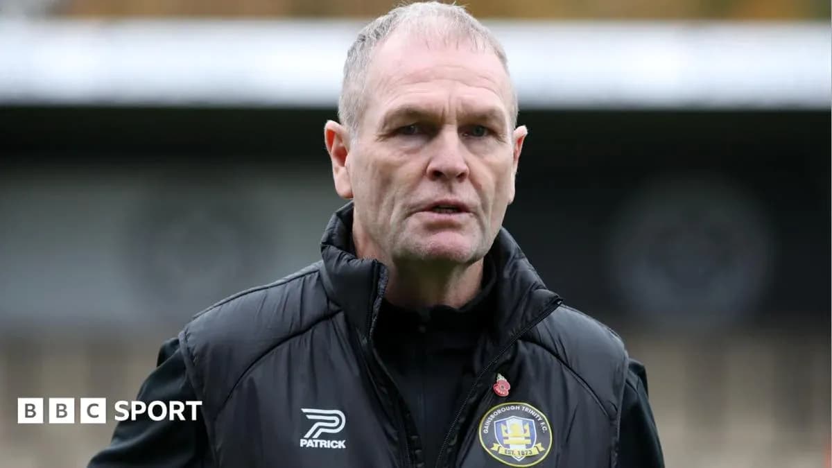 Men's football manager speaking during a training session