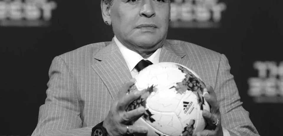 Person holding a soccer ball at event