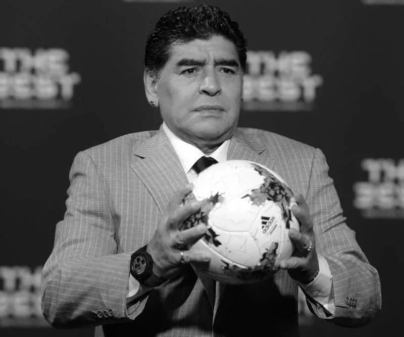 Person holding a soccer ball at event