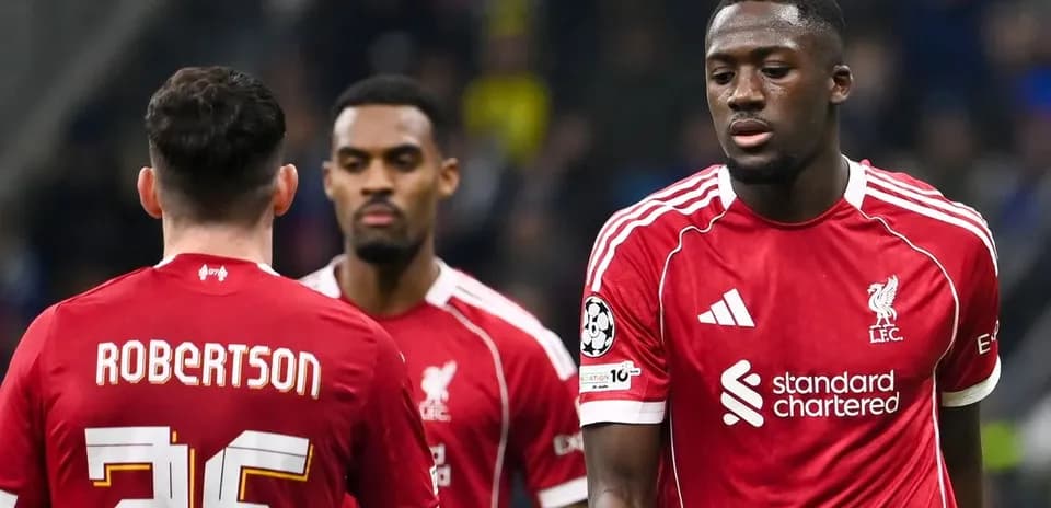 Liverpool players discussing on the pitch during match