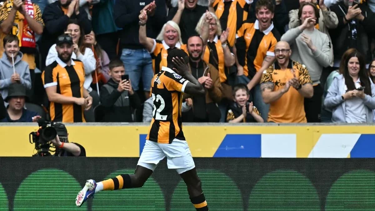Player celebrating in front of cheering crowd