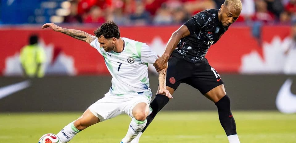 Two players competing for the ball during soccer match