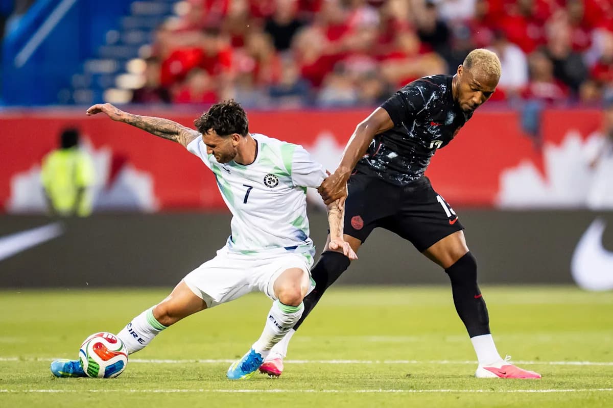 Two players competing for the ball during soccer match