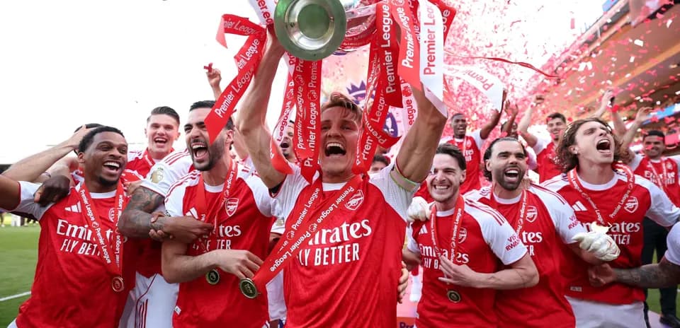 Arsenal players celebrating Premier League trophy victory