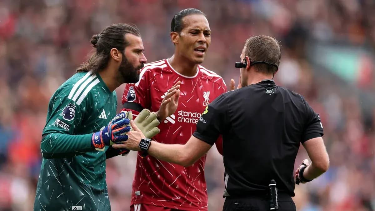Liverpool players discussing with the referee during match
