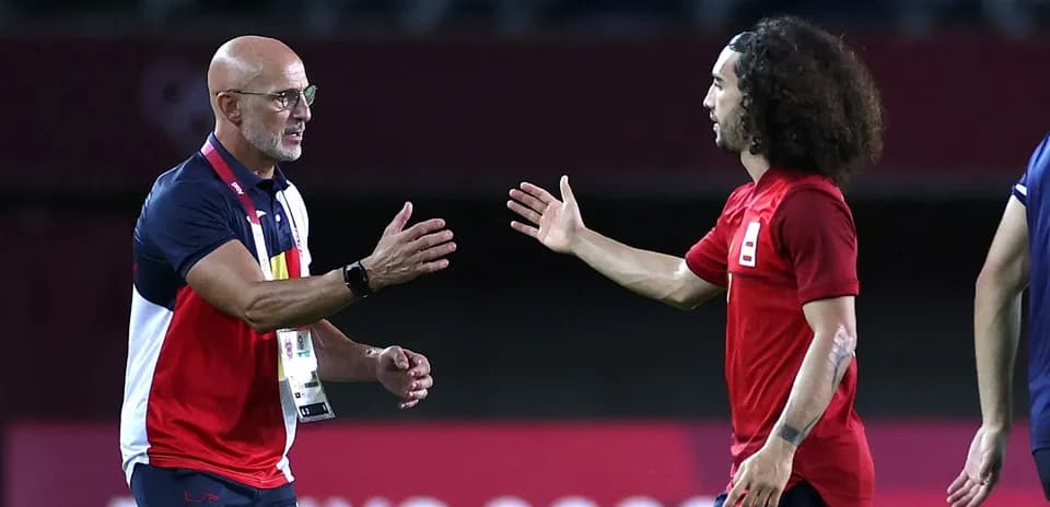Coach and player greeting on the field