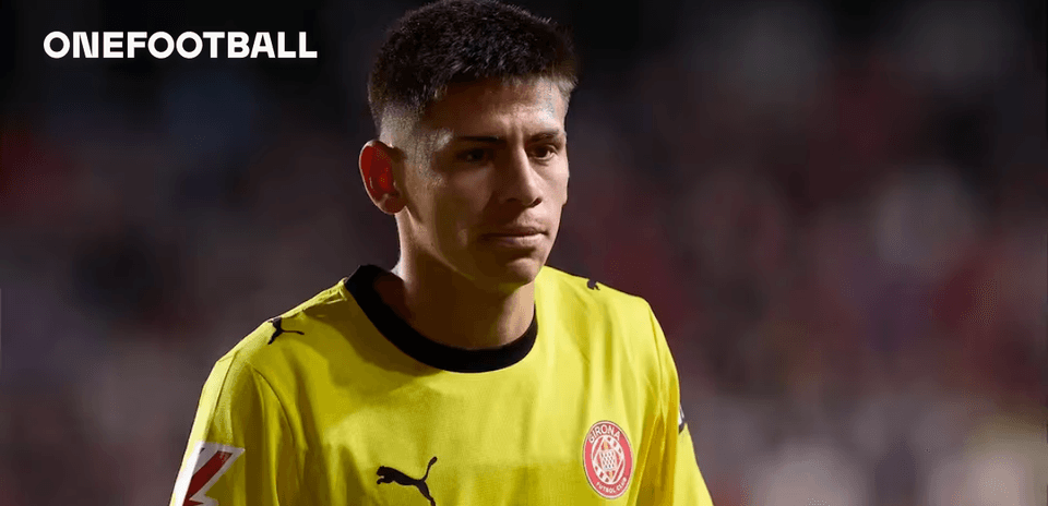 Goalkeeper in yellow kit walking on the field