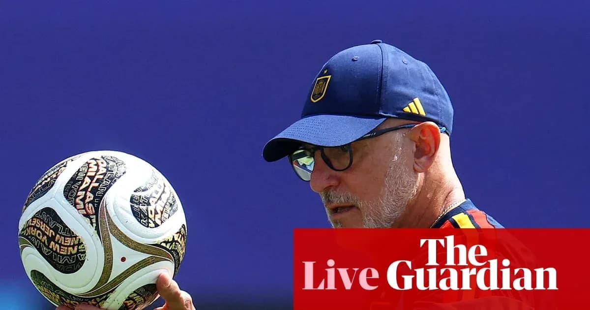 Coach holding a football during training session