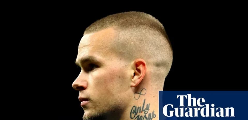 Athlete with short hair and tattoo profile view