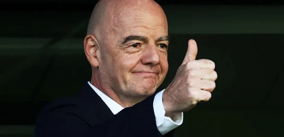 Official giving a thumbs up from the stands