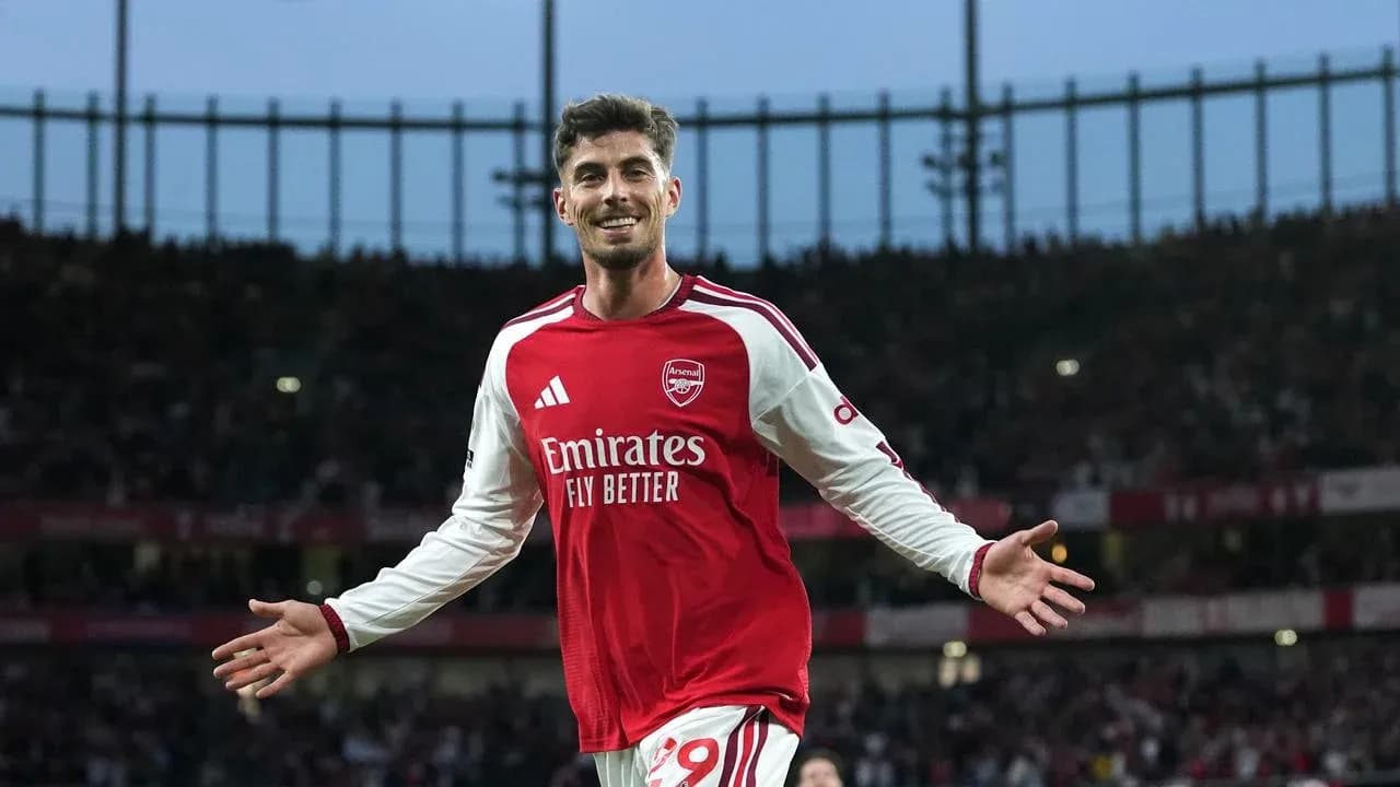 Arsenal player celebrating a goal at stadium