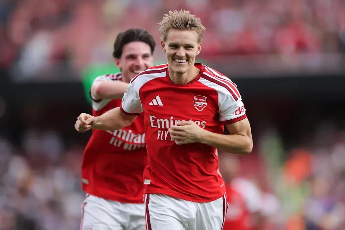 Arsenal players celebrating a goal on the field