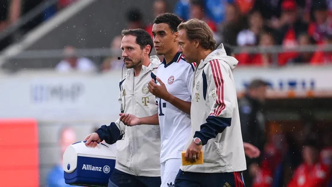 Player being assisted by staff during match