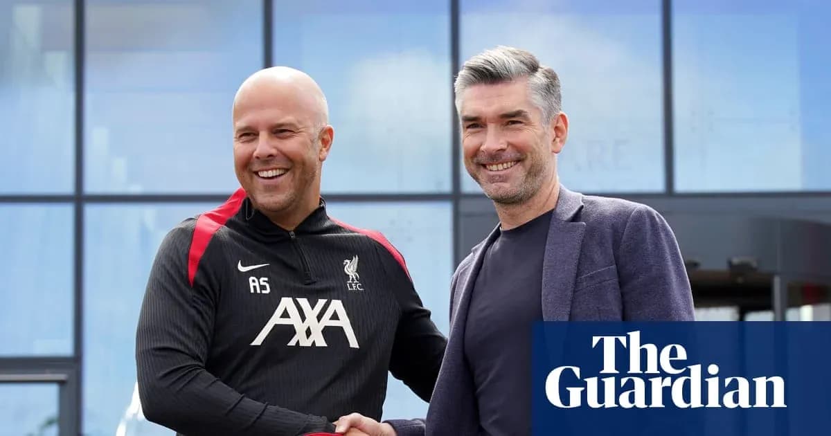 Two men shaking hands outside Liverpool training facility