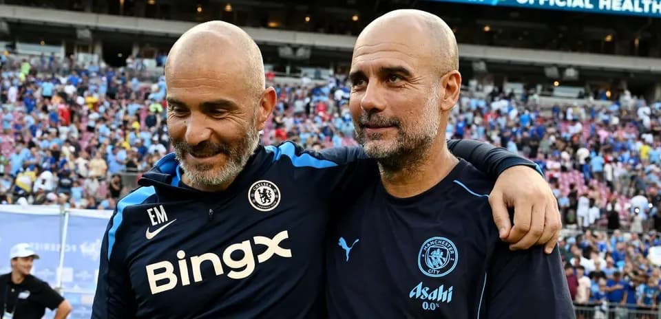 Coaches embracing after a match in stadium