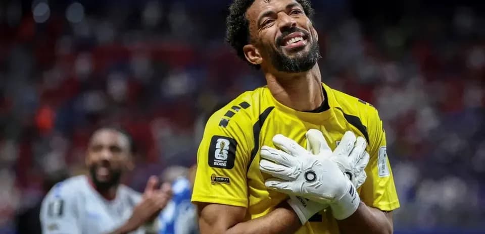 Goalkeeper celebrating with teammates after match