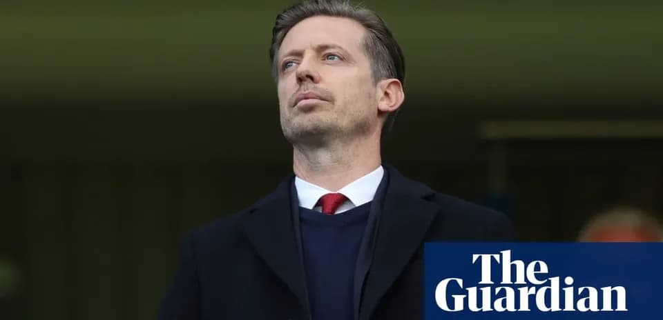 Men's football manager observing from the sidelines