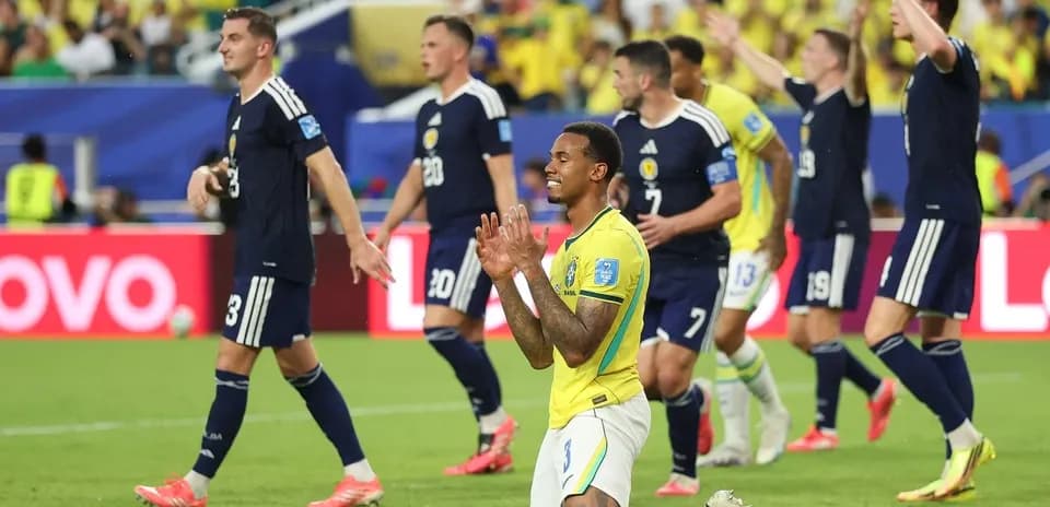 Brazilians celebrating while Scotsmen react in match