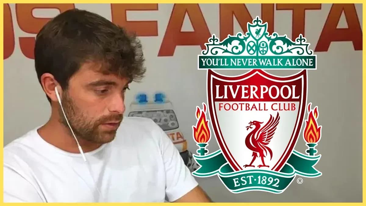 Man listening with earphones near Liverpool FC logo