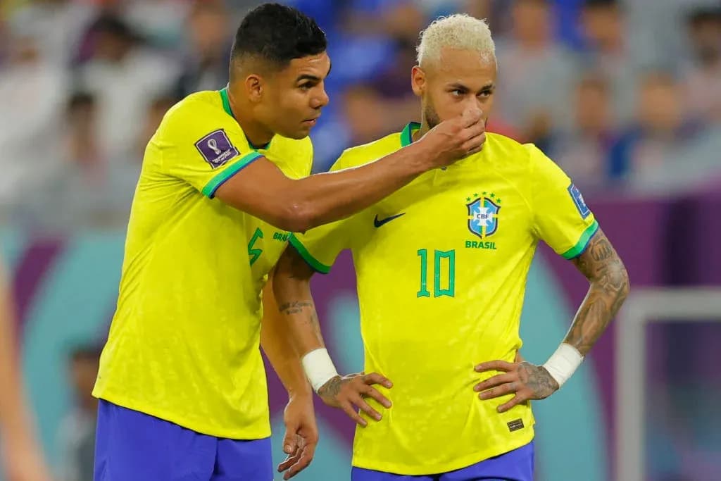 Casemiro whispering to Neymar during match
