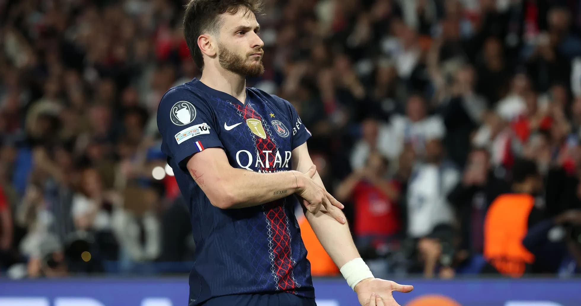 PSG player gesturing to the crowd during match