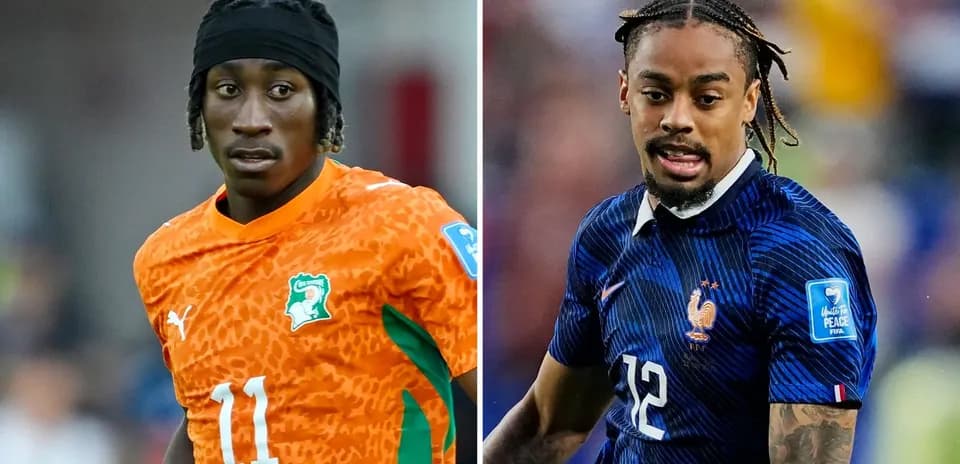 Two football players in national team jerseys
