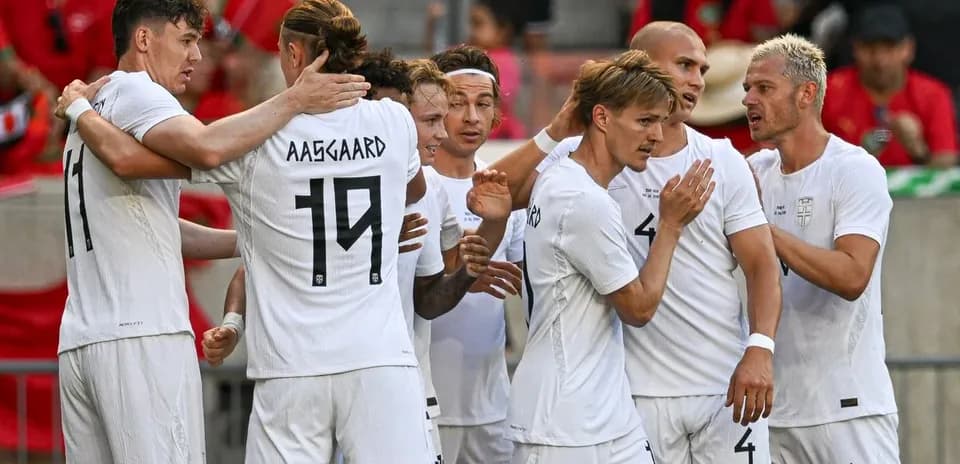 Players celebrating a goal during football match