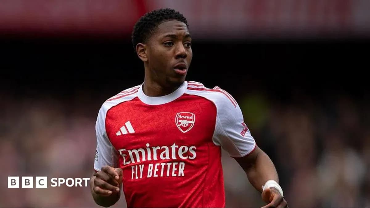 Arsenal player in red kit during match