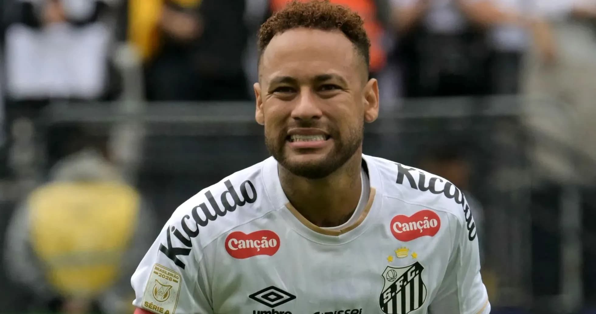 Neymar celebrating after scoring a goal for Santos