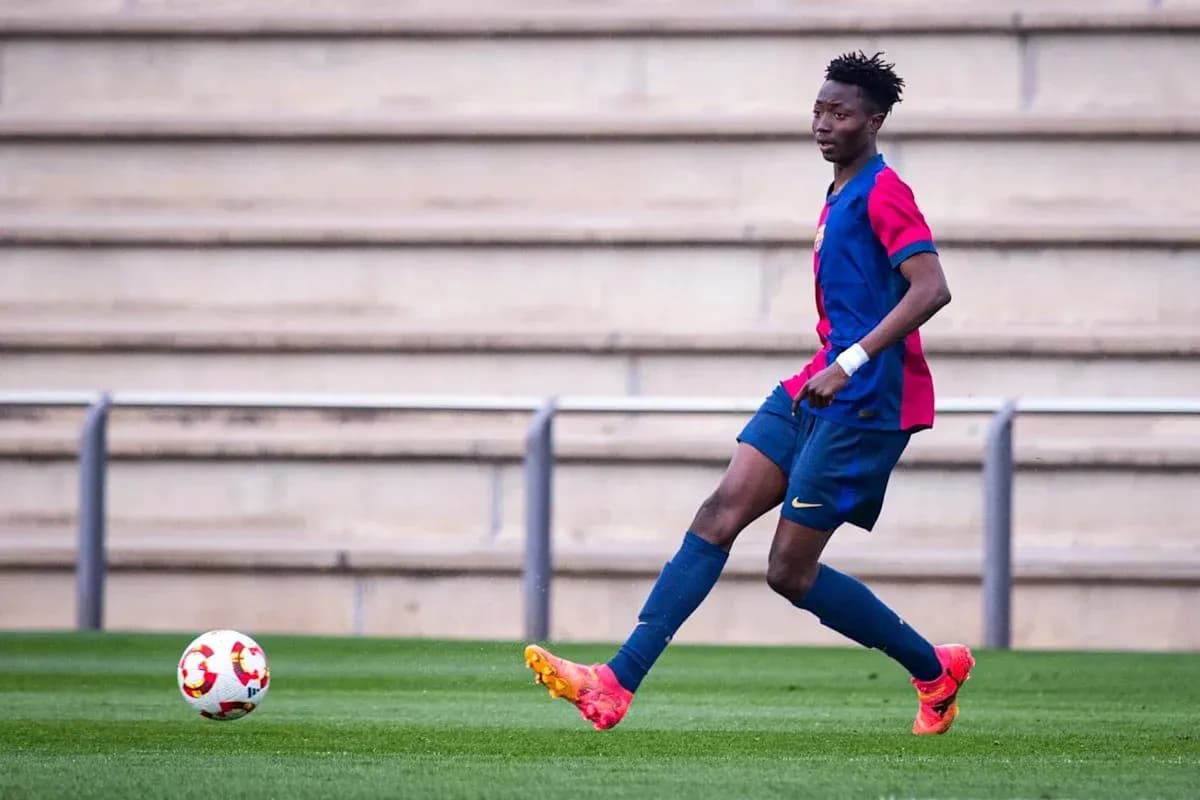 Player in Barcelona kit controlling ball on field