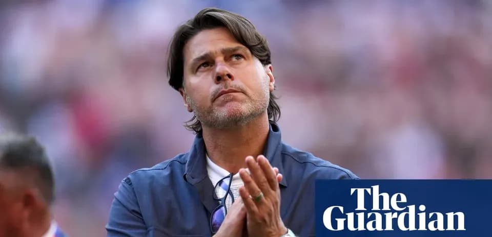 Men's football coach looking up with hands clasped