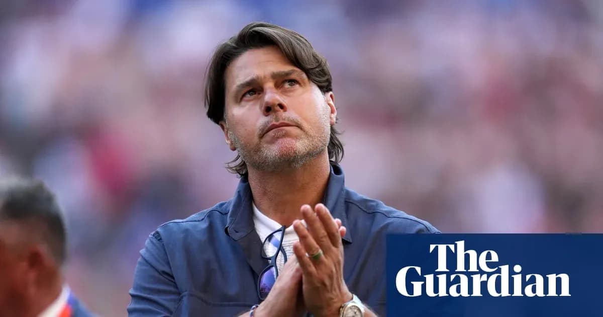 Men's football coach looking up with hands clasped