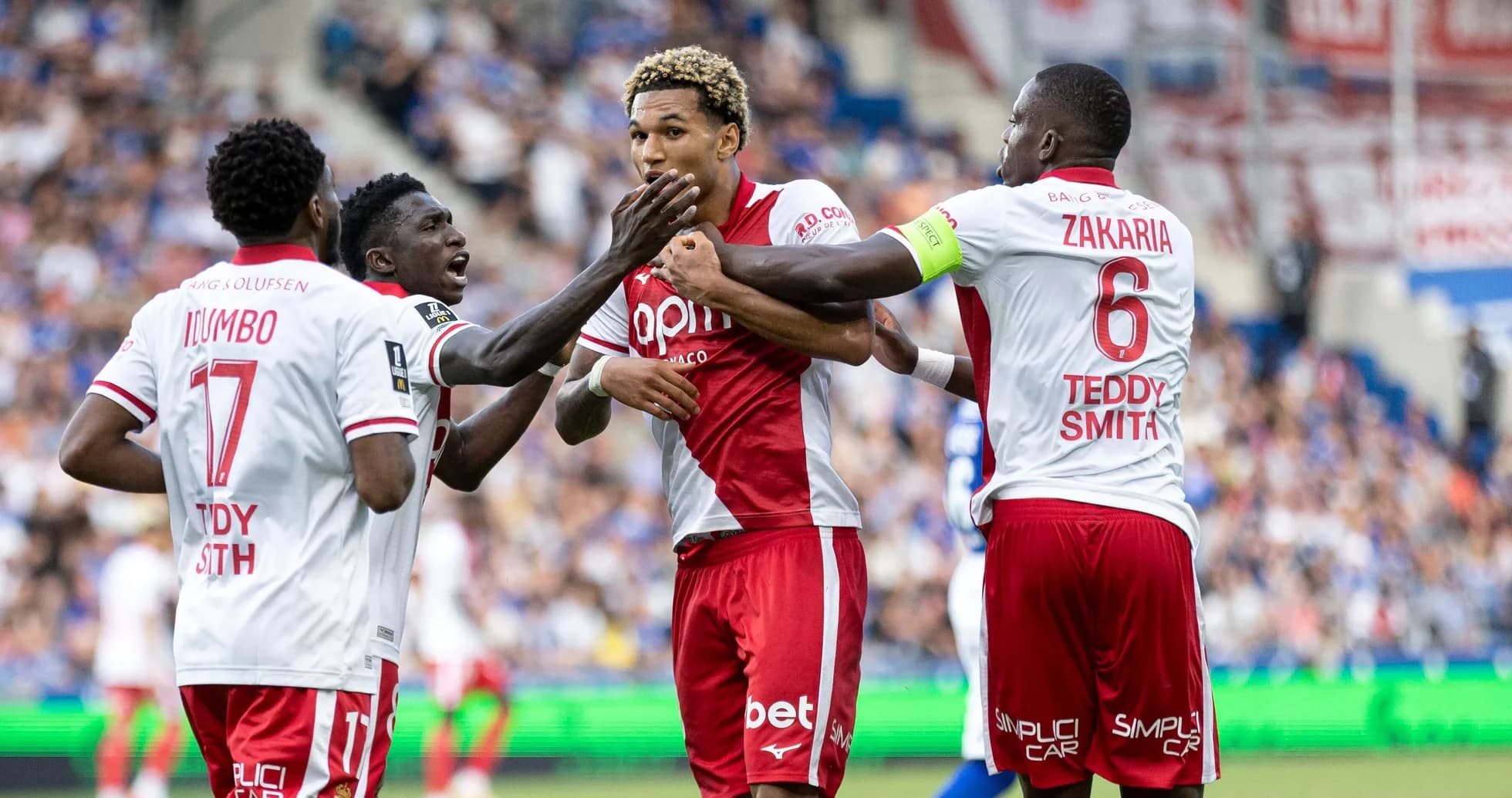 Players celebrating a goal during a match