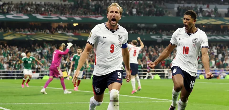 Harry Kane celebrating goal with teammate during match