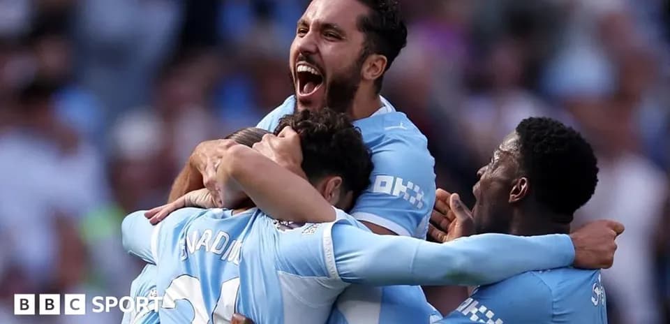 Manchester City players celebrating a goal together