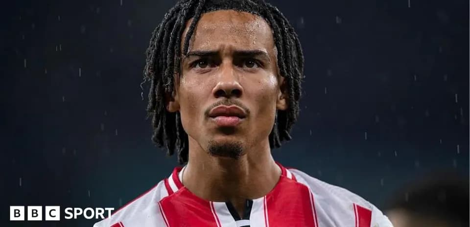 Brentford player focused during rainy match