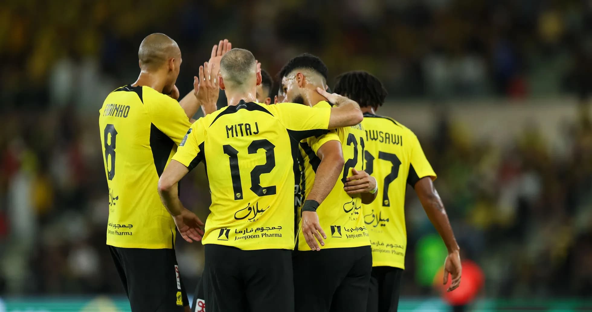 Ittihad players celebrating a goal during match