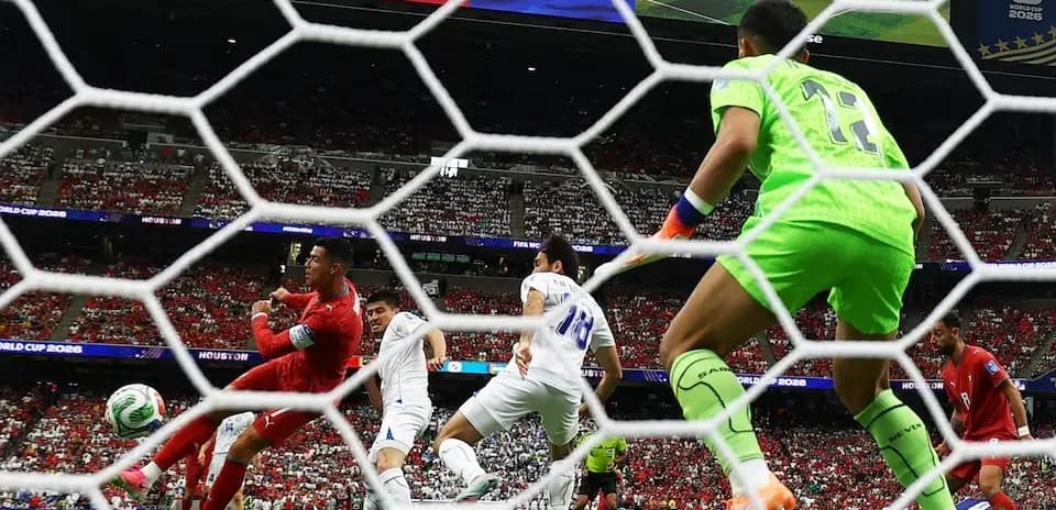 Goalkeeper saving a shot during World Cup match