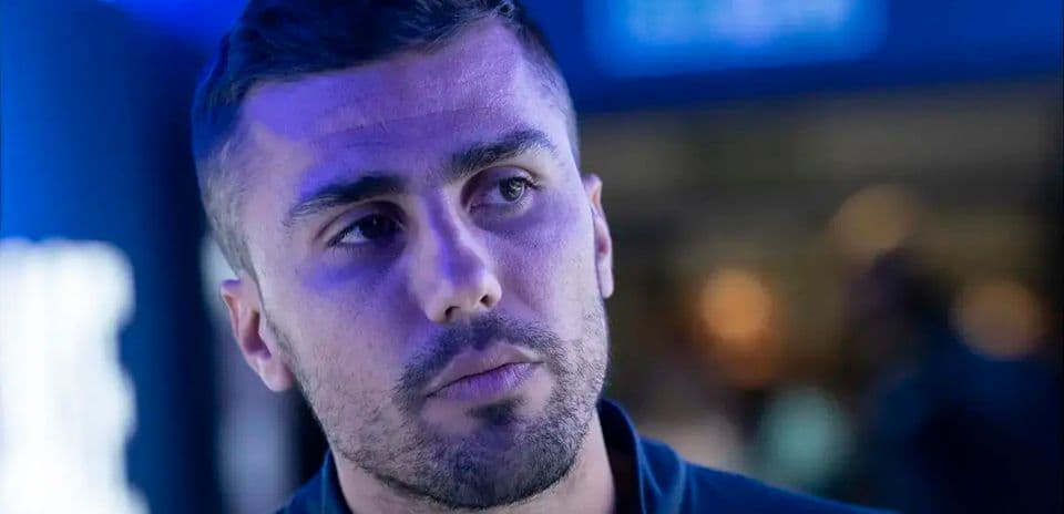 Athlete in a blue-lit environment, focused expression