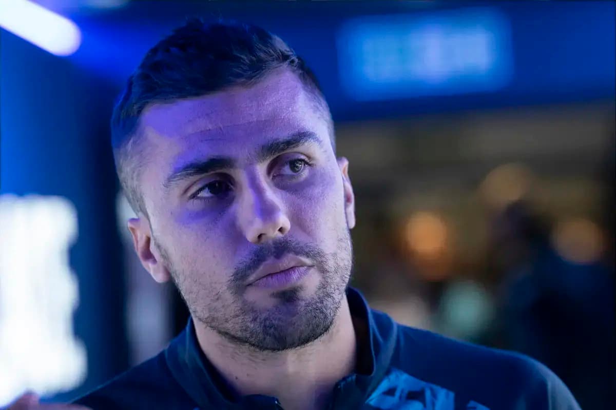 Athlete in a blue-lit environment, focused expression