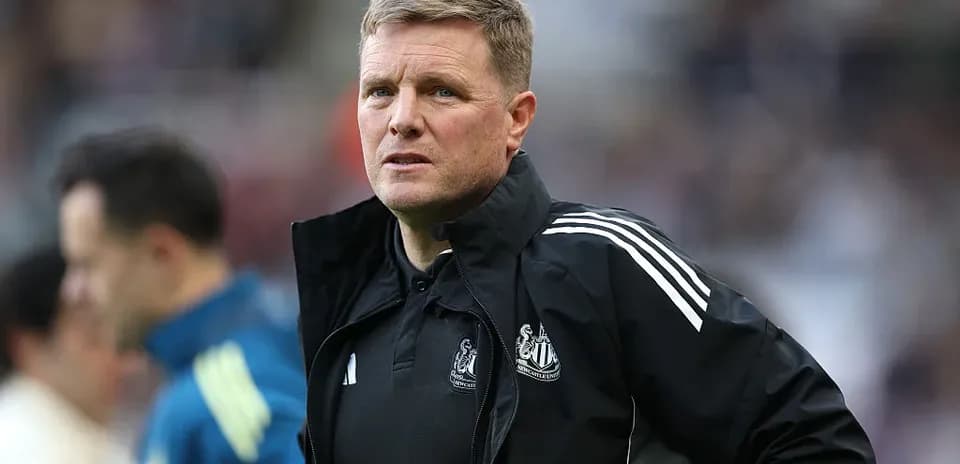 Newcastle United manager observing from the sidelines
