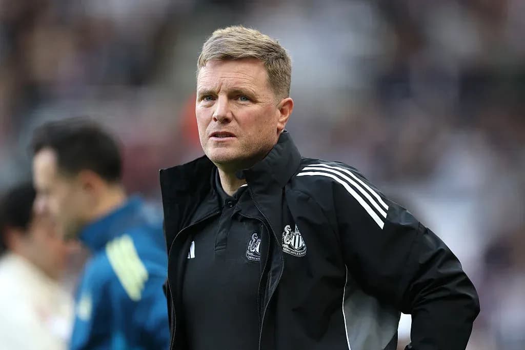Newcastle United manager observing from the sidelines