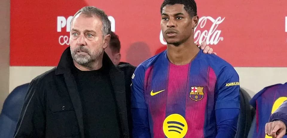 Barcelona coach with player during match substitution