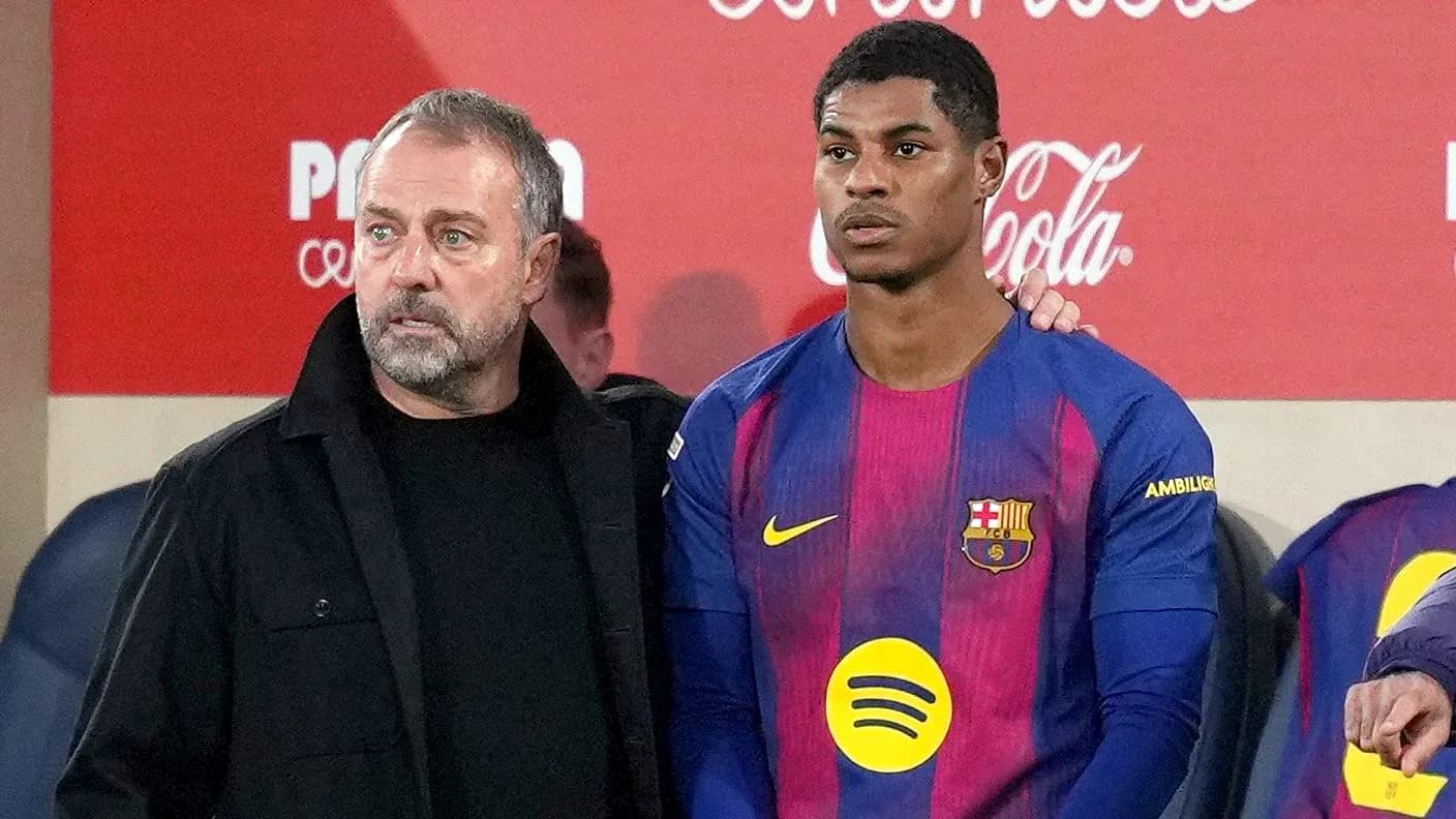 Barcelona coach with player during match substitution