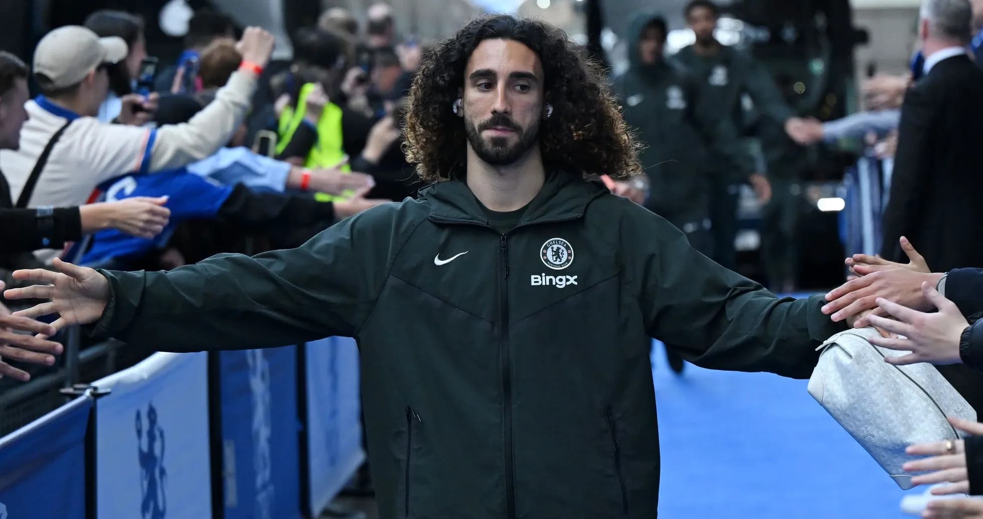 Player greeting fans before the match at stadium