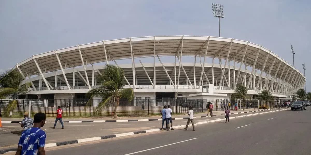 Stadium exterior with pedestrians on the street